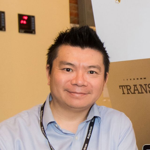 Portrait of Albert Au, smiling, in a light blue shirt